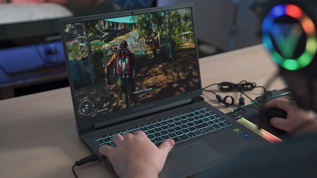 A gamer playing on a laptop